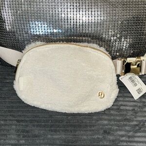 Lululemon everywhere bag, white fur, gold accents, brand new with tags